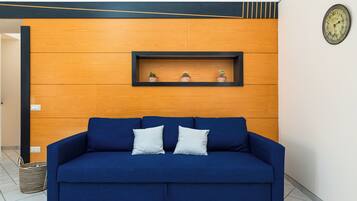 Panoramic Apartment, Sea View | Living area | 42-inch flat-screen TV with digital channels
