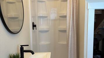 Shower, towels, soap, toilet paper