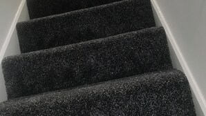 A staircase with a white handrail and carpeted steps. - Peaceful 2-Bed Home, Private Garden & Drive, Nottingham NG6 | Near Hucknall (Nottingham)