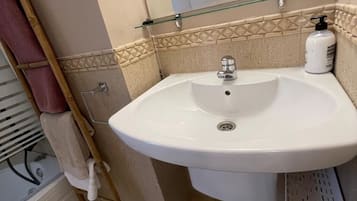 Bidet, towels, soap, toilet paper