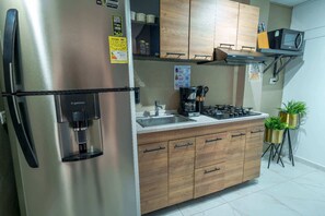 Fridge, microwave, stovetop, coffee/tea maker
