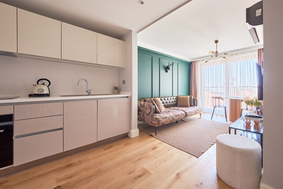 Comfort Apartment, 1 Bedroom, City View | Desk, laptop workspace, blackout drapes, soundproofing