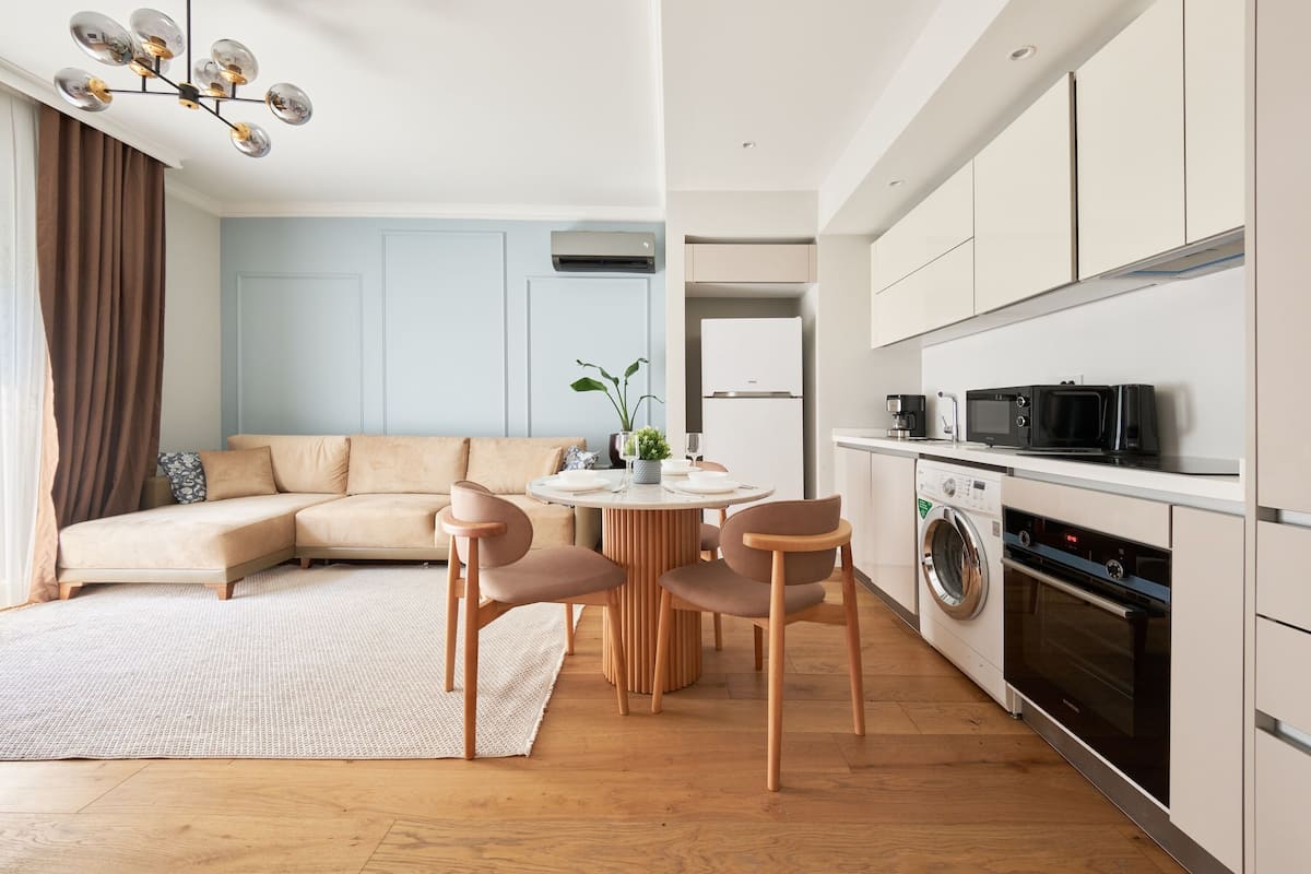 Deluxe Apartment, Balcony, City View | Desk, laptop workspace, blackout drapes, soundproofing