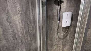 Shower, hair dryer, towels, toilet paper