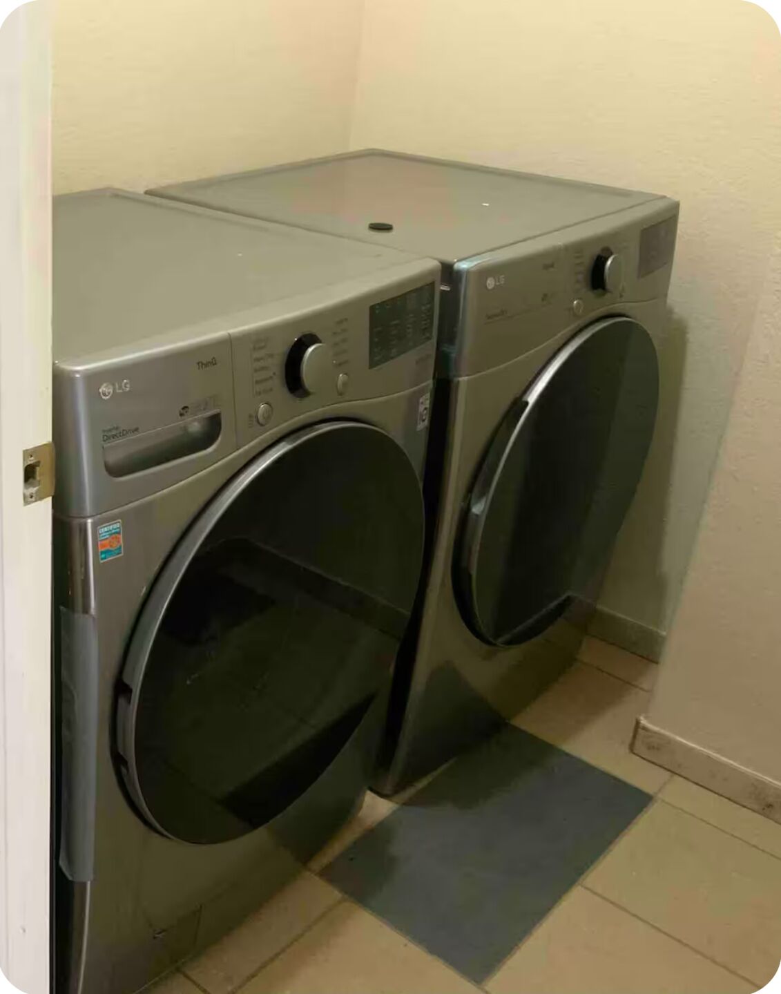 A laundry area with two front-loading washing machines.