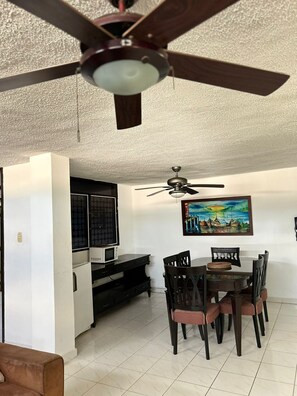 Superior Room, Multiple Beds, Air conditioning | Living area | Smart TV
