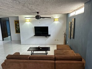 Superior Room, Multiple Beds, Air conditioning | Living area | Smart TV