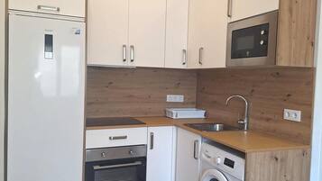 Fridge, microwave, coffee/tea maker, toaster