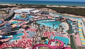 A resort with multiple swimming pools, water slides, and sun loungers. - Golden Beach Aqua Park (Ben M'Hidi)