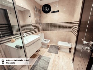 Shower, hair dryer, towels, soap