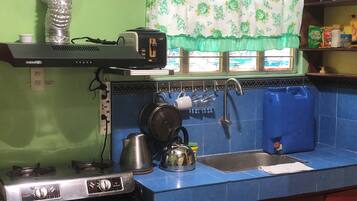 Microwave, stovetop, coffee/tea maker, cookware/dishes/utensils