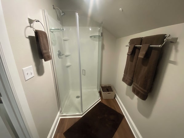 Shower, hair dryer, towels, soap