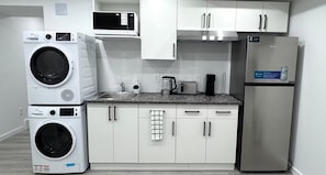 Fridge, microwave, coffee/tea maker, electric kettle - Elegant 1-Bedroom Basement Suite (Winnipeg)