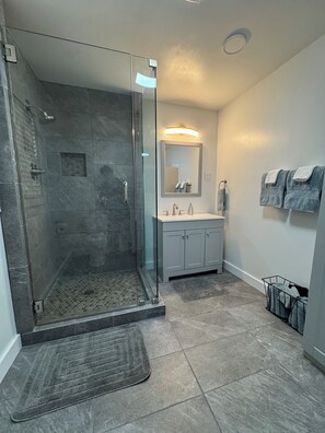 Shower, hair dryer, towels, soap