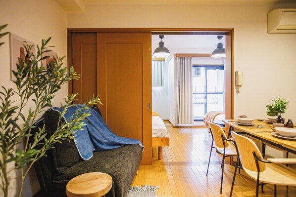 Basic Apartment, City View | Living area | 32-inch flat-screen TV with cable channels