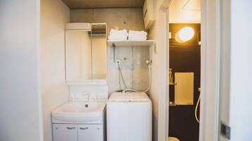 Combined shower/tub, rainfall showerhead, hair dryer, slippers