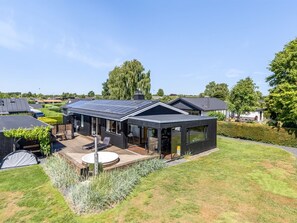 A modern house with a solar panel roof, a deck, and a garden. - "Tecumseh" - 300m from the sea by Interhome (Haderslev)