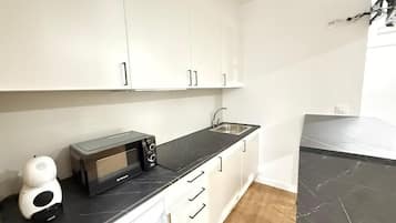 Fridge, microwave, stovetop, coffee/tea maker