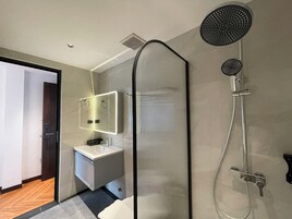 Deluxe Double Room, 1 King Bed, Balcony, City View | Bathroom | Shower, rainfall showerhead, hair dryer, bathrobes