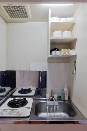 Fridge, microwave, cookware/dishes/utensils
