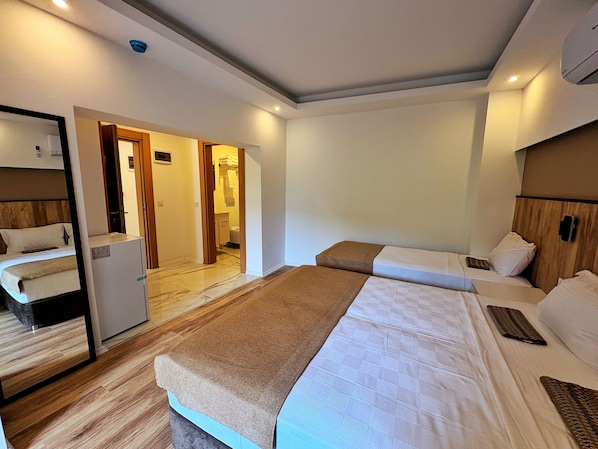 Comfort Triple Room, City View | In-room safe, laptop workspace, free WiFi