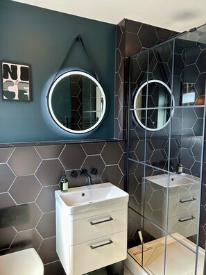 Shower, hair dryer, towels, soap