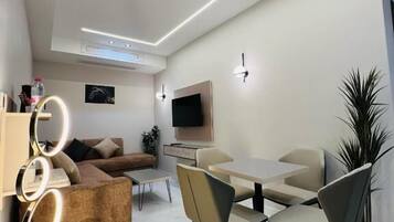 Luxury Suite, Courtyard View | Living area | Computer monitors, printers