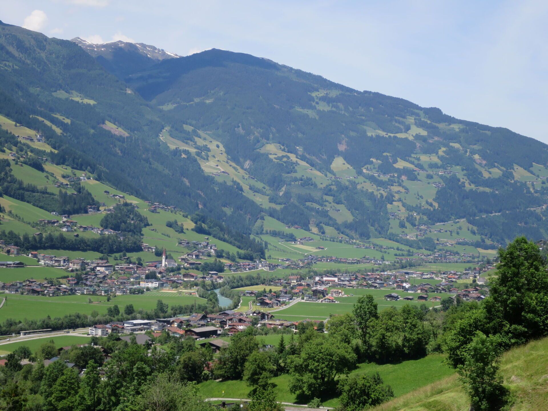 A mountainous landscape with a small town nestled in the valley.