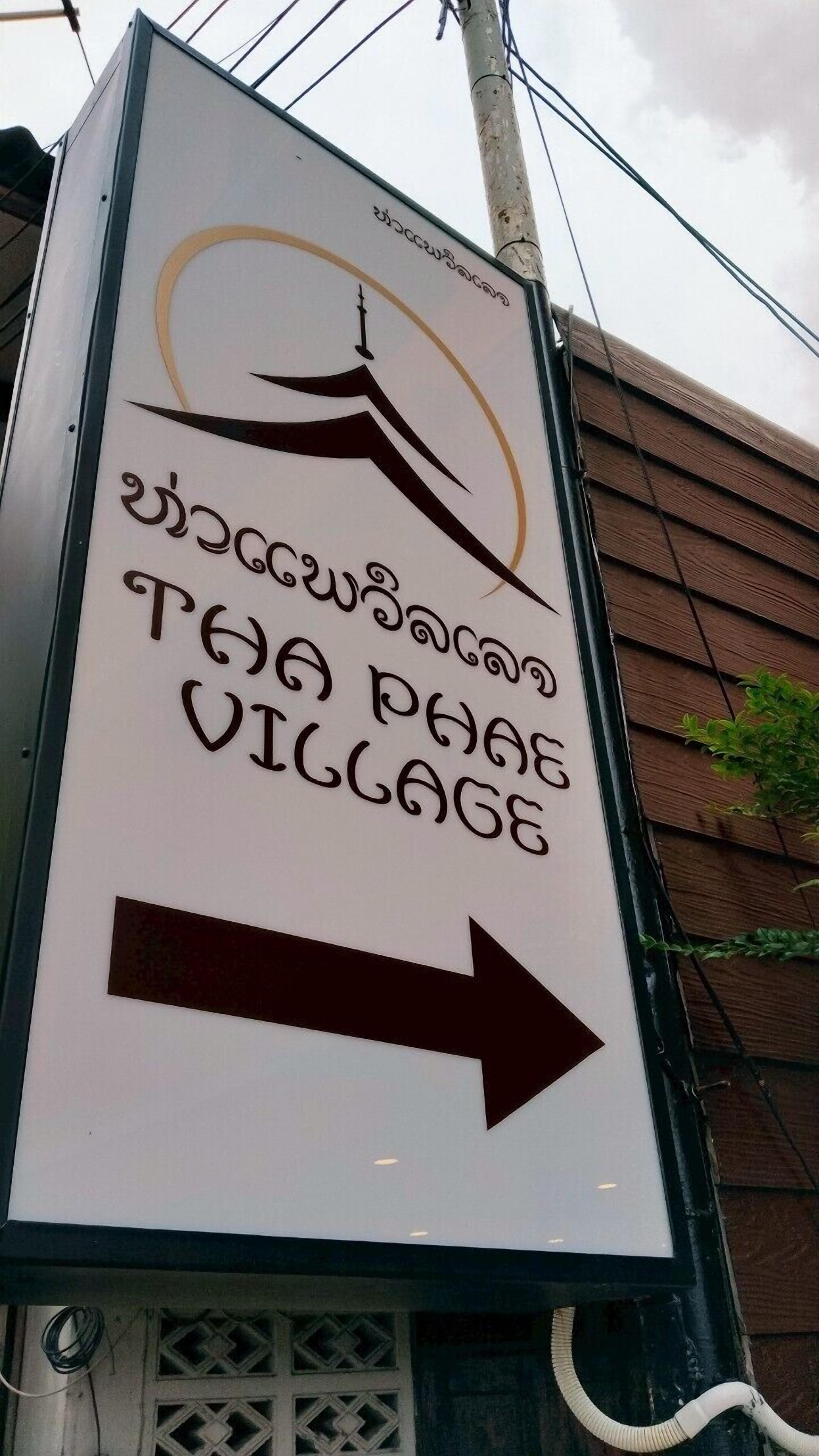 A directional sign for Tha Phae Village.