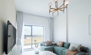 Living area - Bright 2‑Bed Family Home: Pool, Gym & Kids Play (Dubai)