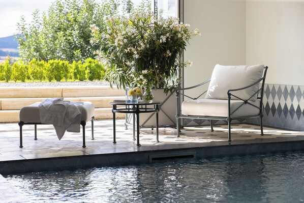 Indoor pool, open 2:00 PM to 8:00 PM, pool loungers