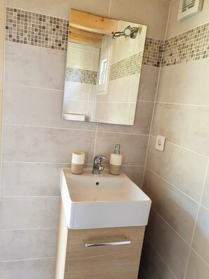 Shower, towels, soap, toilet paper