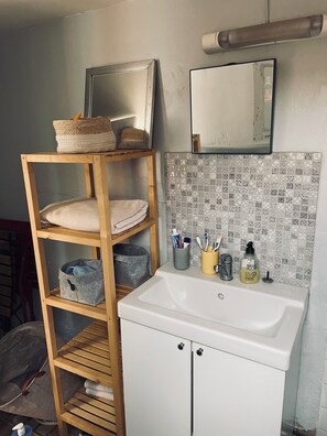 Shower, towels, soap, toilet paper