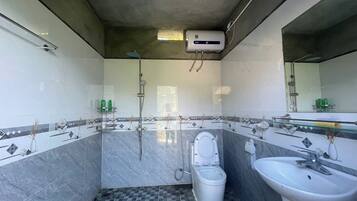 Shower, free toiletries, hair dryer, slippers