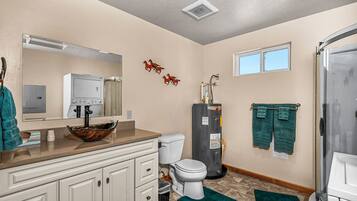 Shower, hair dryer, towels, soap