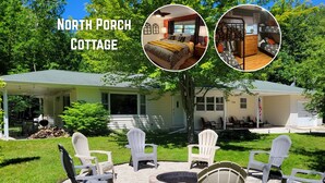 A North Porch Cottage with a covered porch, outdoor seating area with Adirondack chairs, and a fire pit. - Tranquil - North Porch Cottage - New AC - KING & QUEEN beds (Ellison Bay)