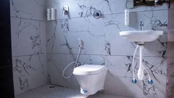 Shower, towels, soap, toilet paper
