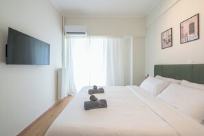1 dormitorio, tabla de planchar con plancha, wifi y ropa de cama
