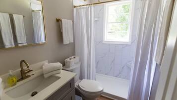 Shower, eco-friendly toiletries, hair dryer, towels