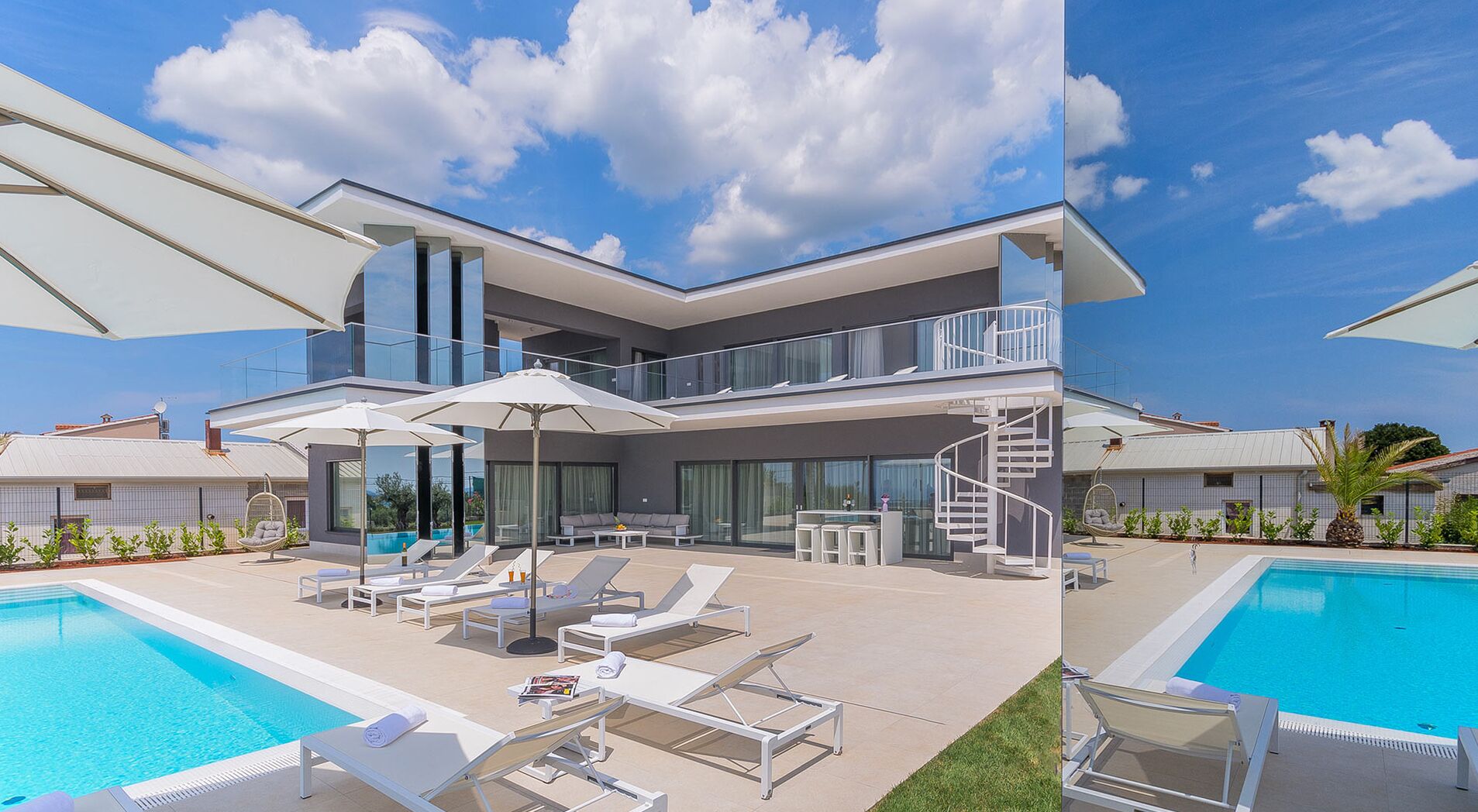 A modern two-story house with a swimming pool, outdoor seating, and a spiral staircase.
