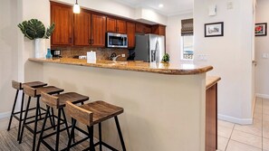 Condo, Multiple Beds, Lanai, Golf View (Waikoloa Beach Villas O22) | Private kitchen | Coffee/tea maker, dining tables