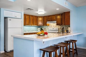 Condo, Multiple Beds, Lanai, Partial Ocean View (White Sands Village 210) | Private kitchen | Full-sized fridge, microwave, oven, stovetop - Condo With Central AC - Partial Ocean View - Concierge - Near Magic Sands Beach - Vrkcv (Kailua-Kona)