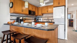 Condo, 1 Queen Bed with Sofa bed, Lanai, Partial Ocean View (Kona Isle C35) | Private kitchen | Coffee/tea maker, dining tables