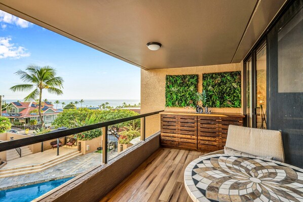 Condo, Multiple Beds, Lanai, Partial Ocean View (Kona Pacific A306) | View from room - Cozy Hawaiian Unit! - Great Ocean View - Sleeps 4+ - Vrkcv (Kailua-Kona)