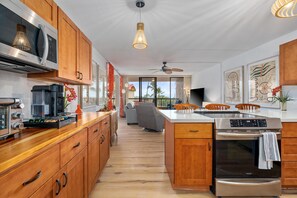Condo, Multiple Beds, Lanai, Partial Ocean View (Kona Pacific A306) | Private kitchen | Dining tables