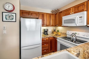 Condo, 1 King Bed, Lanai, Ocean View (Alii Villas 309) | Private kitchen | Coffee/tea maker, dining tables