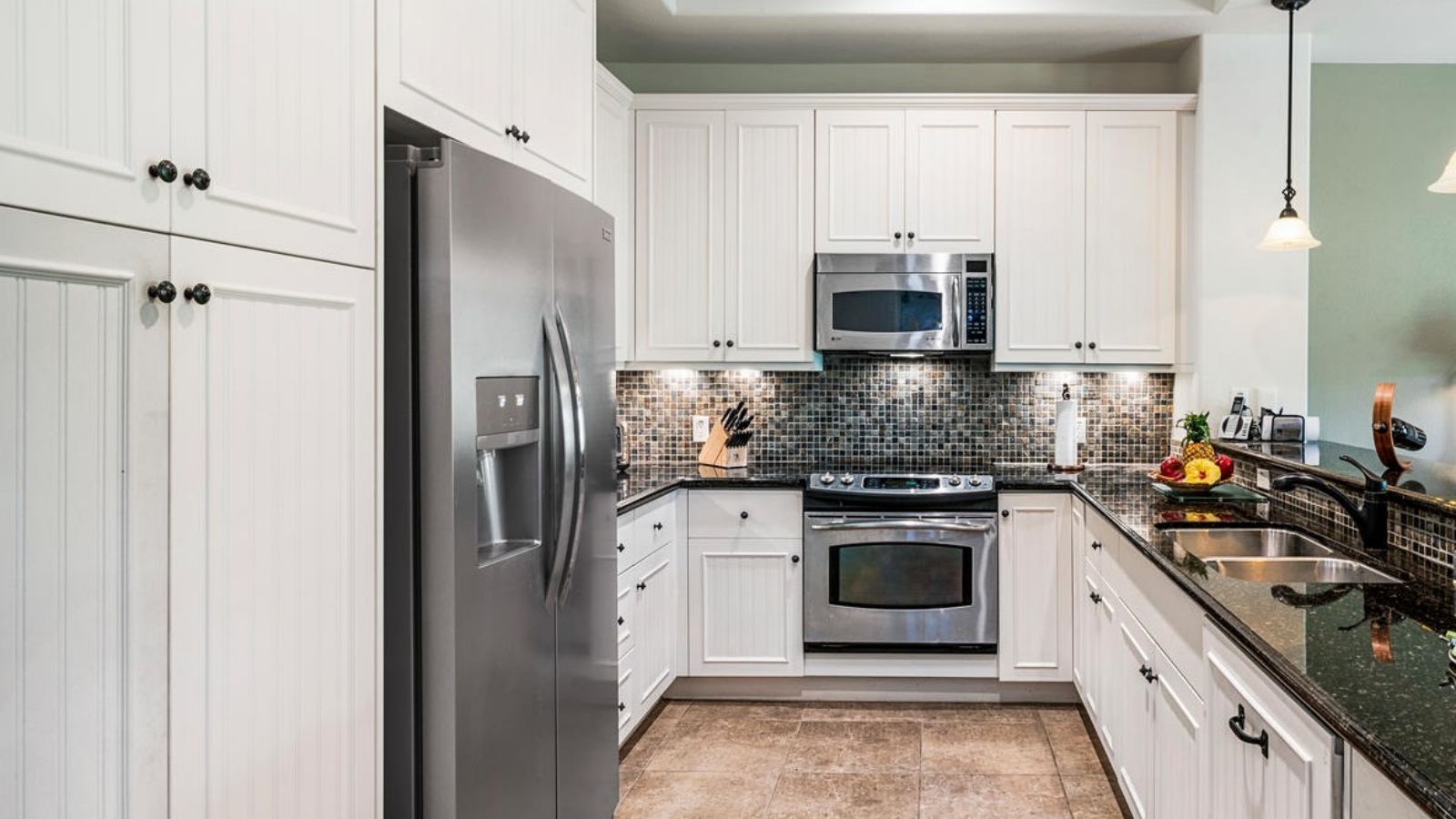 Townhome, Multiple Beds, Lanai, Golf View (Kulalani at Mauna Lani 404) | Private kitchen | Stovetop, coffee/tea maker, dining tables