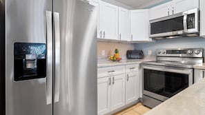 Condo, Multiple Beds, Lanai, Ocean View (Sea Village 3306) | Private kitchen | Coffee/tea maker, dining tables