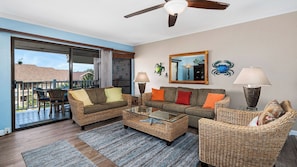 Condo, varias camas, lanai, vista al océano (Sea Village 3306) | Área de sala de estar | Televisión de pantalla plana de 42 pulgadas con canales digitales