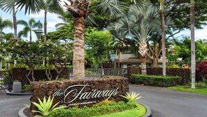 A landscaped area with a sign reading "the Fairways." - Luxurious View Corner Townhome - Great Views - VIP Beach Pass - Vrkcv (Kamuela)
